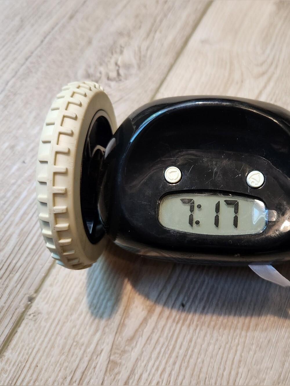 Black Rolling Alarm Clock On Wheels